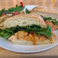 Buffalo Chicken Sandwich · Spicy chicken breast, bleu cheese, red onion, lettuce and tomato on ciabatta. 490c