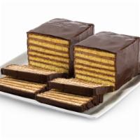 7 Layer Cake · Seven thin layers of a yellow sponge cake stacked in between thin layers of  chocolate butte...