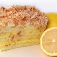 Lemon Cake · Vanilla cake with lemon cream filling and white butter cream frosting.  Coconut flakes on ou...