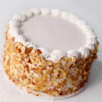 Italian Style Cake · Yellow cake soaked in rum with vanilla and chocolate custard with whipped cream frosting and...