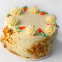 Carrot Cake · Sweet moistened sponge made with carrots and toasted nuts covered in cream cheese filling an...