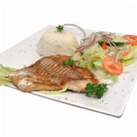 Corvina a la Plancha · Grilled Corvina fish fillet served with white rice and Peruvian creole salad.