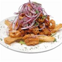 Jalea Grande · Crispy Fried Fish, Shrimp, Calamari and Cassava, Topped with Peruvian Creole Salad.