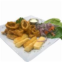 Chicharron De Calamar · Crispy fried calamari with fried cassava yuca, Peruvian creole salad, and tartar sauce.