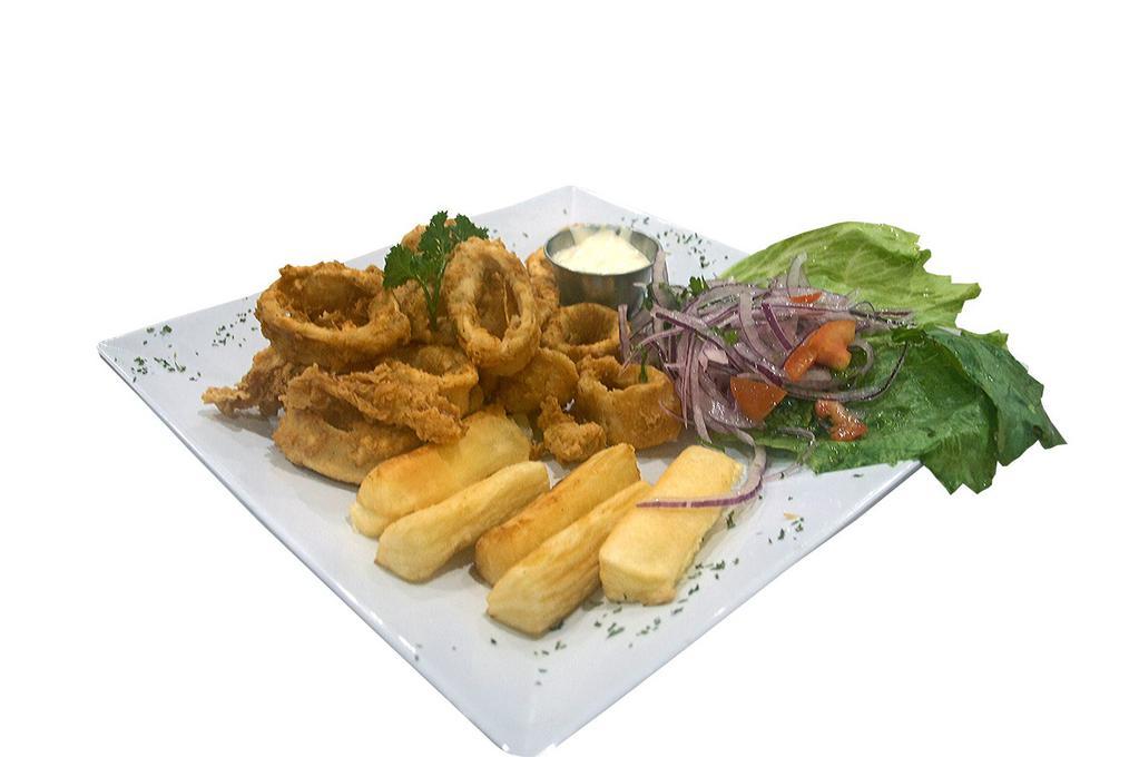 Chicharron De Calamar · Crispy fried calamari with fried cassava yuca, Peruvian creole salad, and tartar sauce.