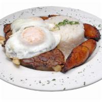 Bistec A La Pobre · Fried steak, served with white rice, sweet plantain, french fries and fried egg.