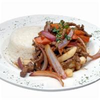 Lomo Saltado De Carne · Sauteed beef with onions, tomatoes, and french fries. Served with white rice.