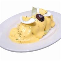 Papa a la Huancaina · Sliced potato with yellow pepper and cheese sauce.