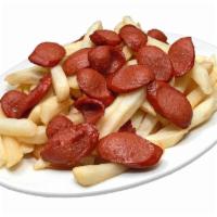 Salchipapas · French fries with sliced hot dog.