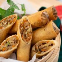 Crispy Spring Roll · Mixed vegetable spring,​ carrots, cabbage,​ taro root,​ peeled split served with ​homemade s...