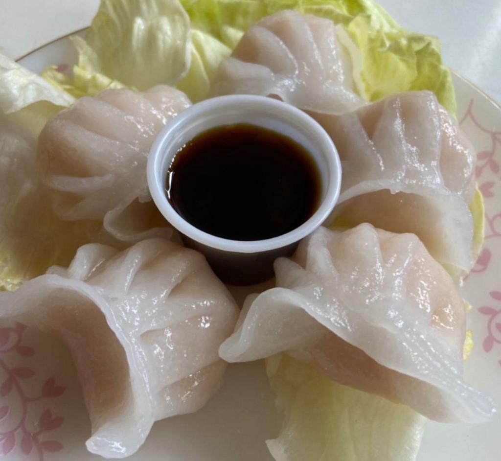 Shrimp Steamed Dumplings · Shrimp Steamed dumpling  served with Thai black soy dipping sauce.