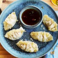 Beef Steamed Dumplings · Beef Steamed dumplings with soy vinaigrette. Served with sweet chili sauce.  