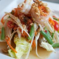 Papaya Salad with Seafood · Green papaya, tomato,carrot peanut and long bean in spicy lime dressing, mixed with seafood.