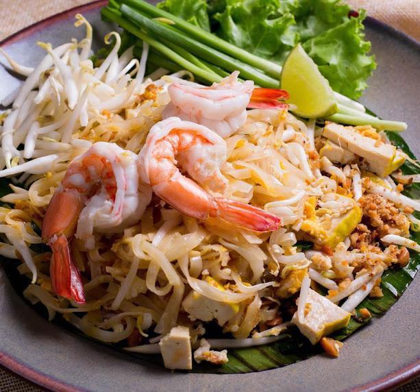 Pad Thai · Thin rice noodles, egg, Thai chive, bean sprouts and roasted peanut with tamarind sauce.