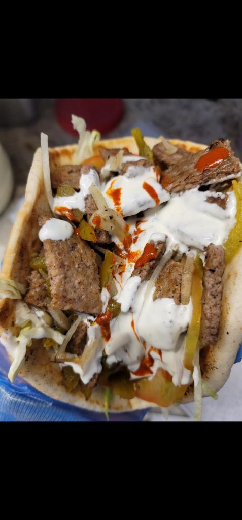 Halal Gyro Beef  · Halal beef, lettuce, tomato, white sauce and hot sauce.