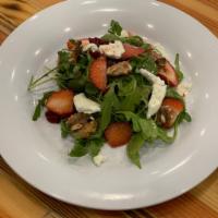 Strawberry and Candied Walnuts Salad · Served over arugula, dried cranberries and goat cheese with raspberry vinaigrette.