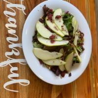 Pear Salad · Mixed greens, dried cranberries, candied walnuts and sunflower seeds, with balsamic dressing.