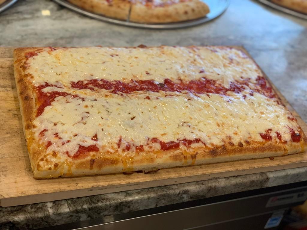 Classic Sicilian Pizza · Tomatoes sauce and grande mozzarella, thick crust.
