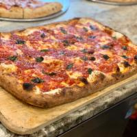 Upside-Down Pizza · Fresh mozzarella cheese, marinara and fresh basil.