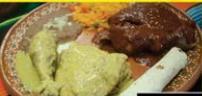 4. Mole · Mole verde o rojo acompanado con arroz, frijoles y tortillas. Chicken breast topped with you...