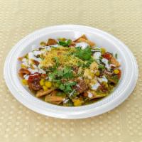 Papdi Chaat (Contains Yogurt) · Chaat made with crispy papdi (fried flour crispies), ragda (boiled white peas), onions, swee...