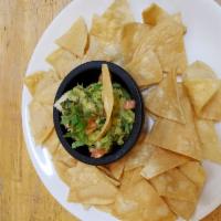 Chips and Guacamole · Corn tortilla chips, avocado, tomato, onion, cilantro lime juice and jalapenos.