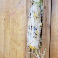 Elote · Grilled corn with mayo and cheese.