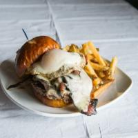 Irish Clover Burger · Premium Angus beef topped with freshly sliced pastrami, roast beef, bacon, fried egg and Swi...