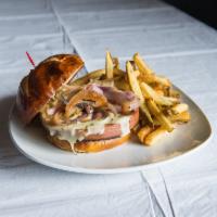 Fried Bologna Sandwich · Thick sliced Bologna, topped with pepper jack cheese, sauteed onions and piled high on a pre...