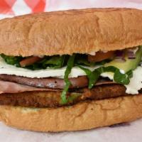 Milaneza Super Torta · Huge Mexican Style Sandwich, with refried beans, Milaneza breaded steak, ham, smoke sausage,...
