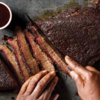 Smoked Peppered Brisket · Smoke Brisket served by the pound with choice of two sides. Sliced and chopped..