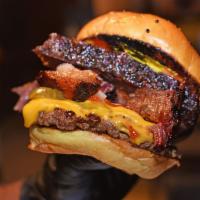 Grilled Backyard Brisket Burger · Ground Brisket Grilled over Hickory Smoked Wood served with Country Fried Potatoes.