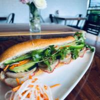 Banh Mi · Toasted baguette with butter spread along with choice of protein, cucumber, cilantro, jalape...