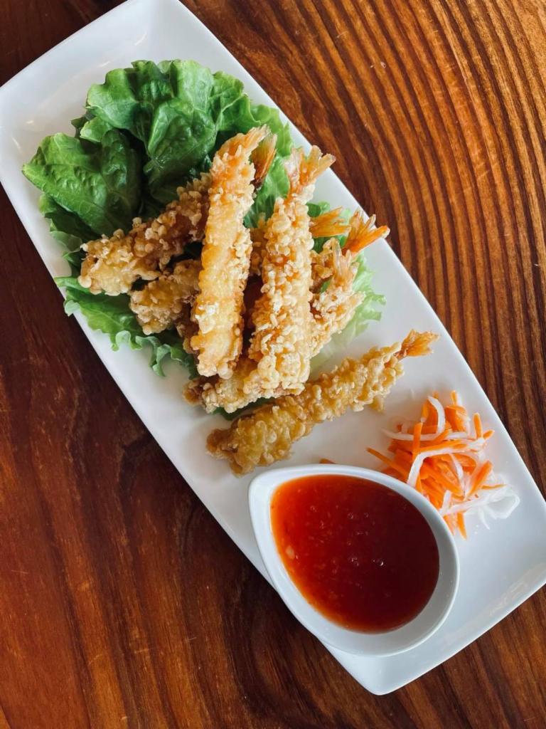 Shrimp Tempura · Shrimp dipped into a creamy egg batter and deep fried to produce a light, crisp, and delicious crust along with a spicy mayo sauce on the side.