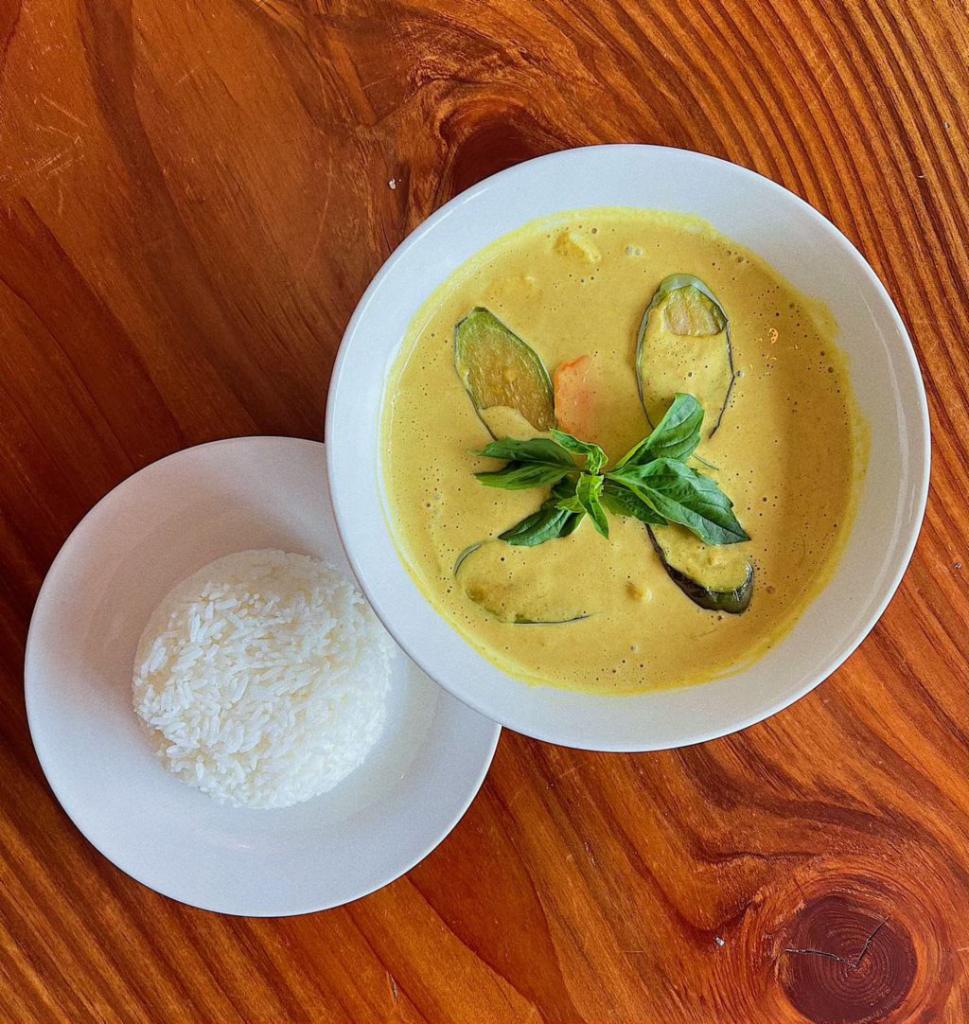 Thai Yellow Curry · Savory and salty curry enhanced by natural sweetness from onions, carrots, sweet yam, and eggplant plus a creamy texture from coconut milk and served with a side of steamed rice.