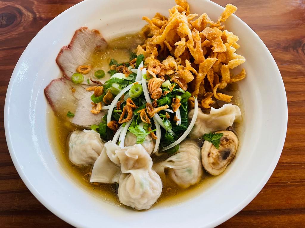 Wonton Noodles Soup · Served flat egg noodles in richly Vietnamese Style chicken broth, comes with savory wonton filled with ground pork and shrimp,  
