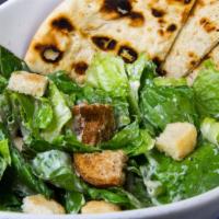 Caesar Salad · Romaine OR Baby Kale, garlic roasted croutons, creamy Caesar dressing and Romano cheese.
