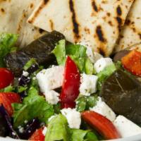 Greek Salad · Mixed greens, cucumber, tomatoes, red onion, mixed peppers, grape leaves, olives and feta ch...