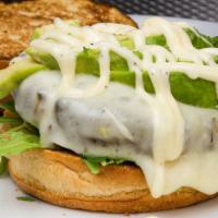 Signature Burger · Truffle mayonnaise, baby arugula topped with avocado and provolone cheese. Served with coles...