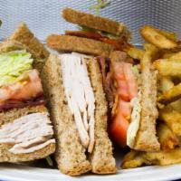 Turkey Club Deluxe Sandwich · Bacon, lettuce, tomato and french fries.