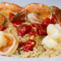 Shrimp Scampi · Served over rice with garlic butter sauce. Served with potato and vegetables.