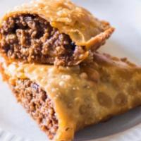 Grande Beef Empanada · deliciously seasoned ground beef, a hint of black bean, special seasonings, wrapped in a cor...