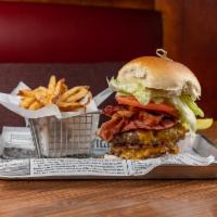 Monster Burger · 2 - 8 oz. burgers topped with bacon, Taylor ham, cheddar cheese, lettuce, tomato, red onion