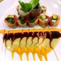 Seafood summer roll · Rice paper wrapped with tuna ,salmon ,shrimp,mango,mix green