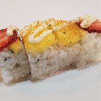 Caribbean Roll · 4 pieces. Strawberries and crab salad topped with mango, strawberries, and mayo.