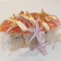 Tokyo Roll · 4 pieces. Crab salad topped with fresh salmon, red onions, fried garlic flakes, and mayo. Raw.