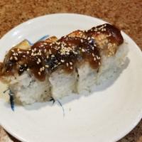 Dragon Roll · 4 pieces. Shrimp tempura, crab salad topped with unagi, avocado, unagi sauce, and masago.