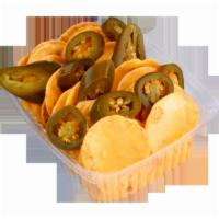 NACHOS · Round Tortilla Chips with Nacho Cheese and Jalapeños Slices / Chips Redondos de Tortilla con...