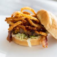 Western Burger · Cheddar cheese, crispy fried onion straws, BBQ sauce, lettuce, and mayo.