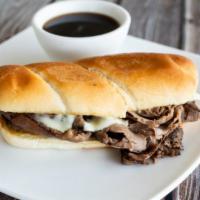 French Dip Sandwich · Thinly sliced roast beef piled high on a hoagie bun with melted Swiss cheese. Served with au...